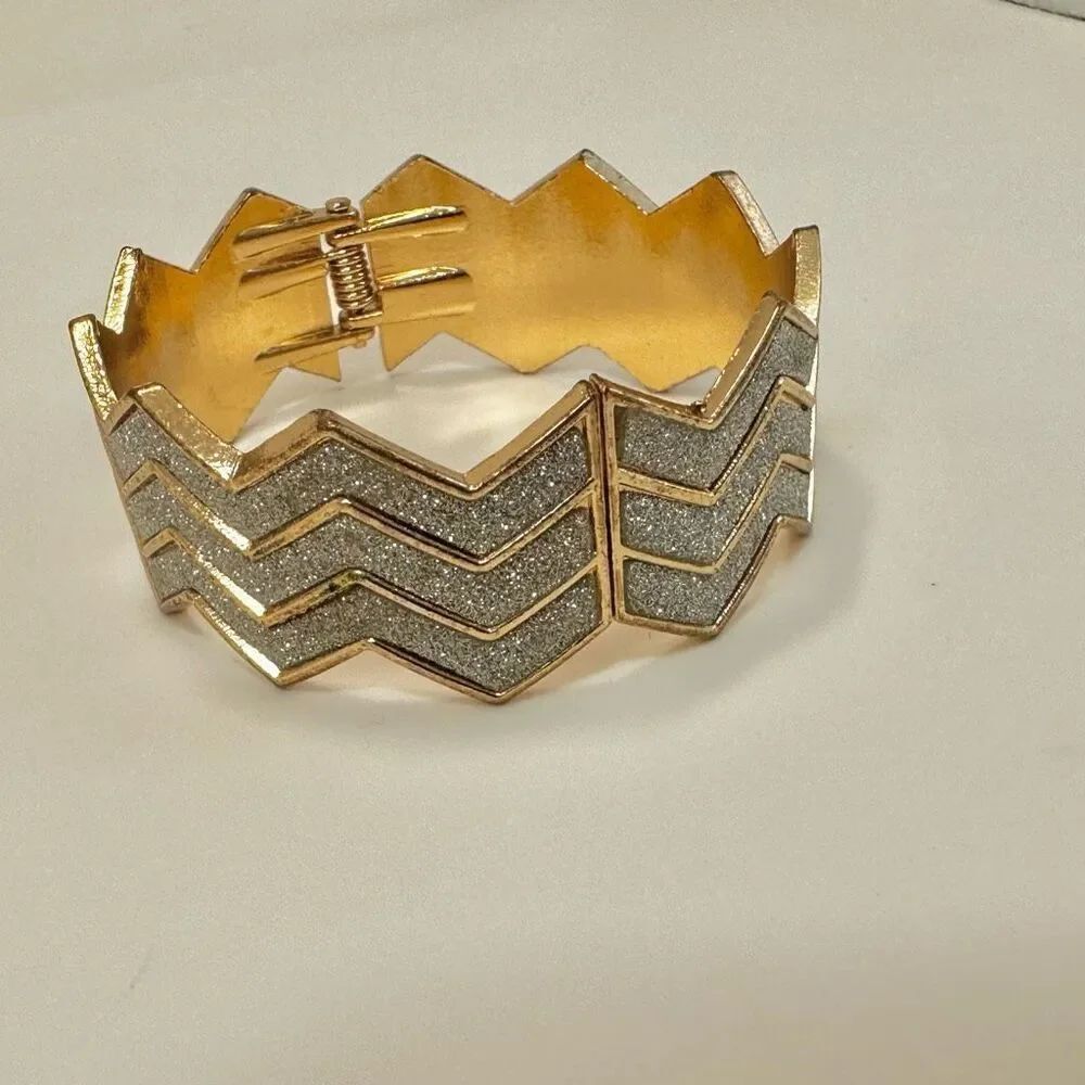 Gold tone rhinestone hinged bangle bracelet